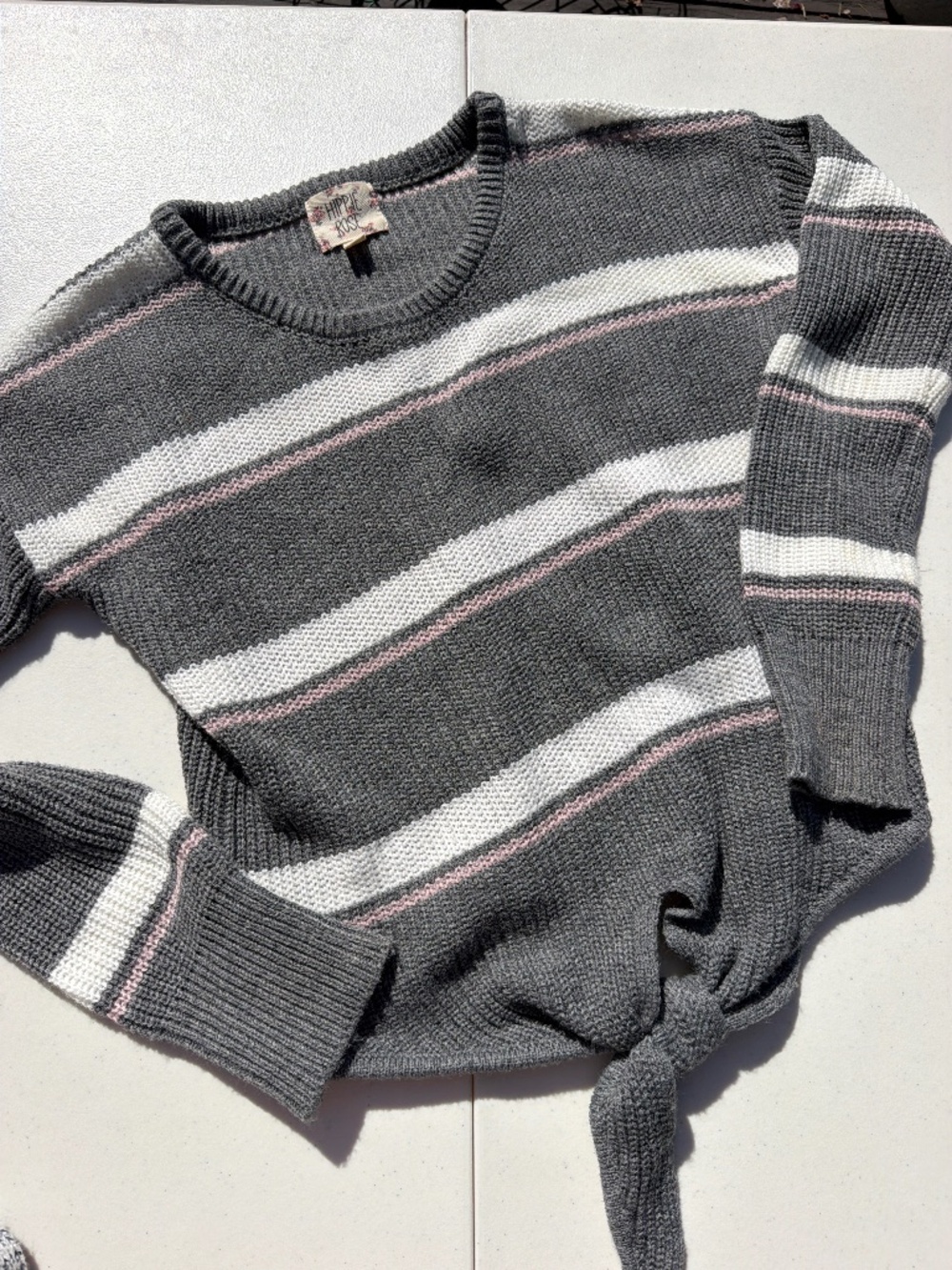 Hippie Rose sweater women features a distinctive tie-front hem and gray, white,